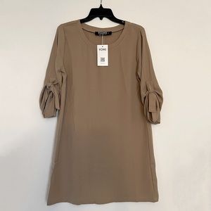 Tags on - tan dress. 3/4 length sleeve.